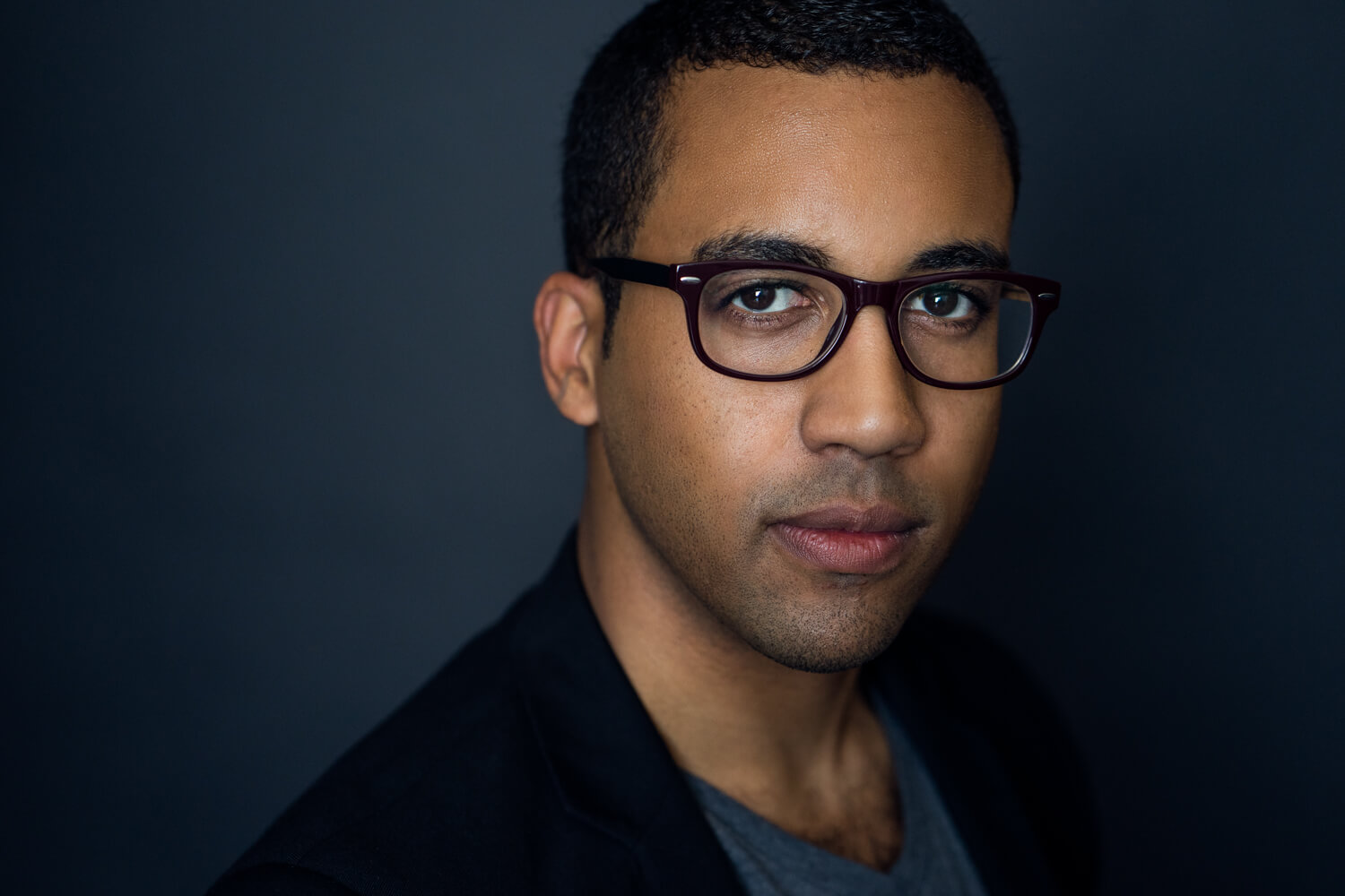 Headshot of a man in glasses by David Suh Photography